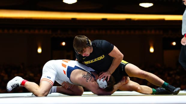 No. 9 redshirt senior Brock Mauller (149) in match against Illinois No. 30 Joe Roberts, Thursday, Dec. 21, 2023. Mauller defeated Roberts 14-5 MD.